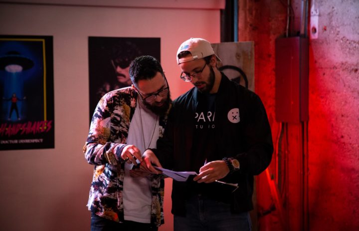  Director and 1st AD discuss scenes 